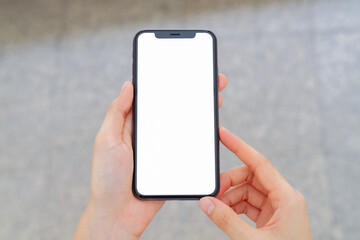 Hand holding smartphone mockup of blank screen, Take your screen to put on advertising.
