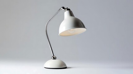 A stylish desk lamp with a flexible arm, designed for functional lighting.