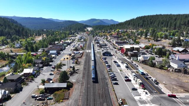 Truckee California - Train Leaving Downtown Train Station - Aerial 4K
