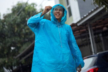 Young Man Wear Raincoat in a Rainy Day, The Concept of the Rainy Season
