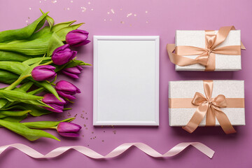 Frame with purple tulips and present on color background