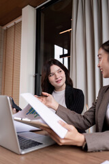 Collaborative Financial Strategy Session Between Two Professional Women