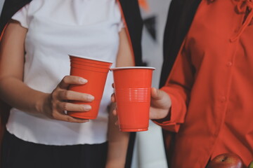 friendship, holiday and people concept - group of happy smiling friends in halloween costumes of...