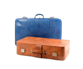 Blue and brown retro leather suitcases on white background