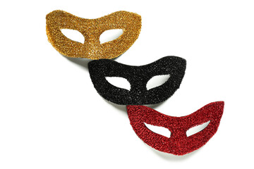 Bright carnival masks on white background