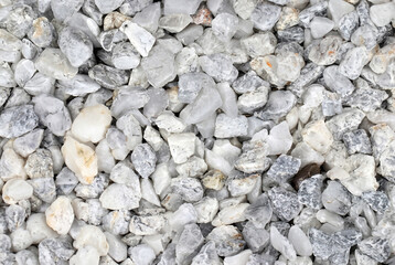 Close-up of white and gray gravel stones, ideal for construction, landscaping, or decorative purposes