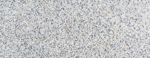 Close-up of terrazzo floor texture featuring mixed stone chips, ideal for architecture, flooring, and design projects
