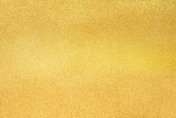 Close-up of gold glitter texture with a shimmering surface, perfect for festive backgrounds, design, and luxury themes