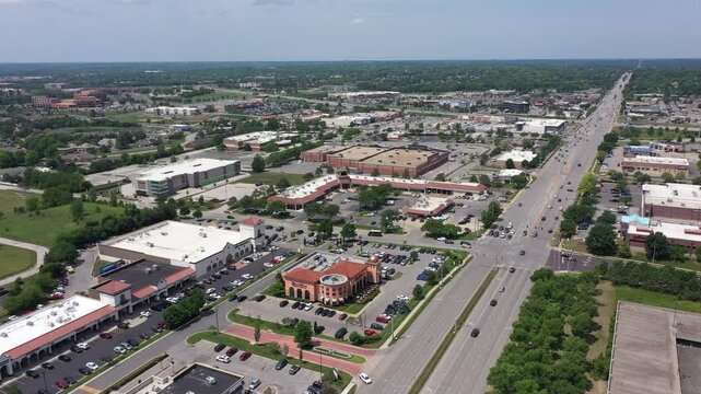 Overland Park, Kansas, USA - June 17, 2023: Morning traffic passes through the downtown commercial district of Overland Park.