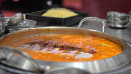 Spicy Rapokki - Korean tteokbokki rice cake and ramen noodle in hot pot at korean restuarant. Korean food style.