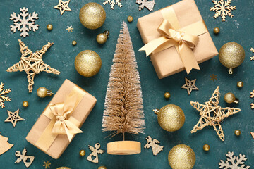 Beautiful composition with decorative Christmas tree, gifts and balls on blue background, closeup