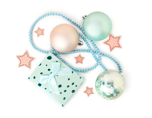 Gift box with Christmas balls, decorative stars and beads on white background