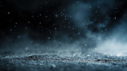 A close-up view of particles suspended in the air, creating a misty, atmospheric effect.