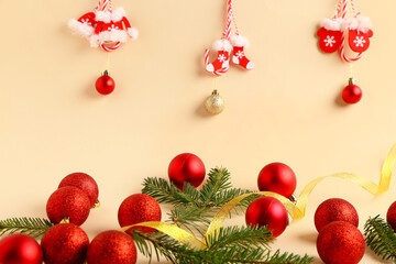 Composition with stylish Christmas decorations and fir branches on color background