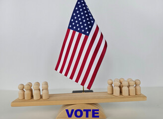 A group of voters stand on a platform in front of the American flag