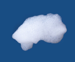 White foam isolated on blue background.