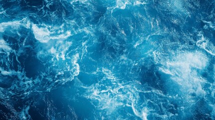 A close-up of the ocean surface with whitecaps and blue water.