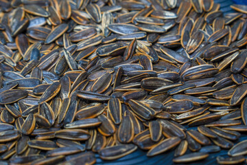 Close-up view of black sunflower seeds after roasting.