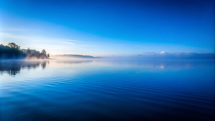 Serene Mist Shrouded Lake, Azure Sky Reflecting on Calm Waters