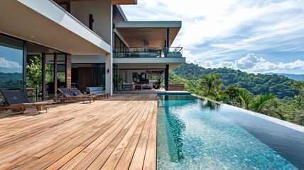 Fototapeta premium Modern villa with a stunning pool, surrounded by lush greenery and scenic mountains, perfect for relaxation and luxury living.