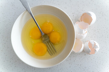 Egg yolks in white bowl ready to mix