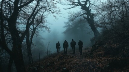 Four Figures Walking Through a Foggy Forest