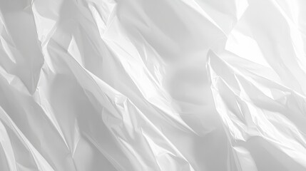 Fototapeta premium Folded white paper with sharp creases creating geometric patterns on a minimal background