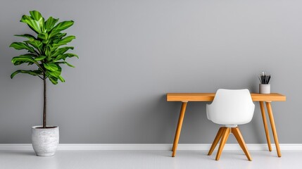A minimalist home office featuring a sleek wooden desk, modern chair, and simple decor, with potted plants providing a refreshing touch
