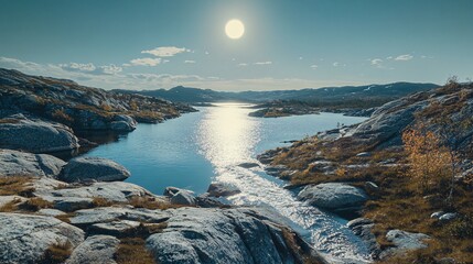 Fototapeta premium A scenic view of a lake with a small waterfall and sun reflecting off the water.