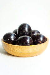 Grilled salted eggs on wooden bowl. Salted eggs are usually made from duck eggs fermented with ash and salt.