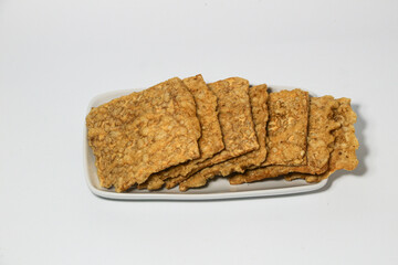 tempe or keripik tempe or kripik tempe. tempeh chips a typical Indonesian food made from soybeans and thinly sliced