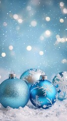 Fototapeta premium Blue Christmas Ornaments on a Light Blurred Background.