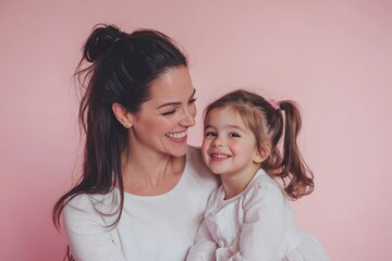 Subject: 30s woman in light clothes have fun with 5 years old girl. Portrait on solid light pink background. Perfect for Mother's Day, love family, parenthood childhood concept.
