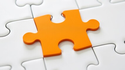 Obraz premium Picture of an orange puzzle piece that fits into a white puzzle. Teamwork, solutions, and problem-solving concepts are emphasized