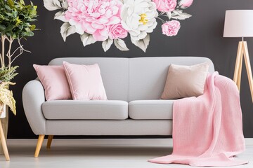 Photograph of a floral living room interior with a wallpaper, sofa, and plants
