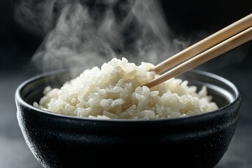 Japanese rice, Cook rice. Close up natural steaming cooked Japanese white rice in black bowl with chopstick on black background, soft focus. Healthy Food Concept. generative ai