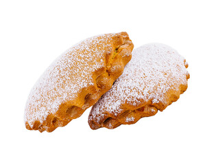 Two freshly baked cookies covered with sugar powder on white background