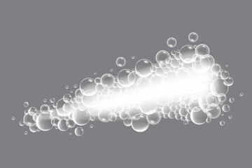 Soap bubbles, displaying unique designs, gracefully float on a plain gray surface