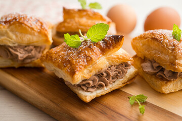 Miguelitos with chocolate truffle cream. Spanish chocolate puff pastry dessert
