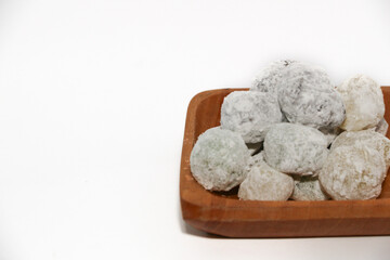 Mochi - trendy and sweet dessert, Mochi cake on a plate on a white background.