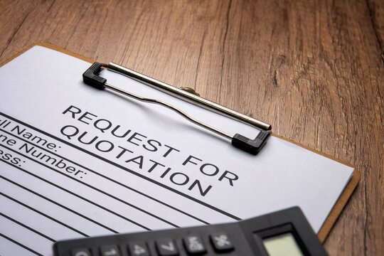 A clipboard with a paper titled “REQUEST FOR QUOTATION” and a black calculator. Procurement or pricing inquiries in a corporate setting concept.