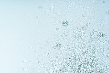 Gentle ripples form on a serene blue surface