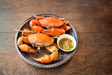 Steamed Crabs Served with Thai Seafood Dipping Sauce on a Wooden Tray - Traditional Thai Seafood Dish