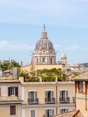Obraz premium Rome, Italy - April 11, 2024: Rome, Italy - April 11, 2024: Rooftops and houses of the city of Rome, Italy