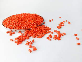 Red masterbatch granule, red pigment, red granules in a cup, cold cutting type granule texture,...