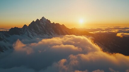 Obraz premium Majestic Sunrise Over Snow-Capped Mountain Peaks