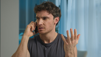 Caucasian man athlete talking mobile phone smartphone call sport guy male sportsman technology...