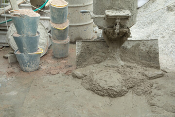Concrete with cement mixer machine at construction site.