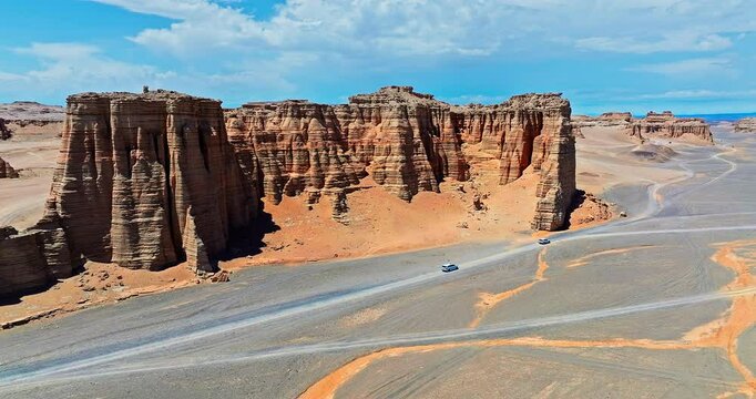 Spectacular Dahaidao Yadan landform natural landscape in Xinjiang, China. Driving a car through the desert Gobi in no man's land.