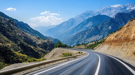 Fototapeta premium Scenic Mountain Road Surrounded by Majestic Peaks